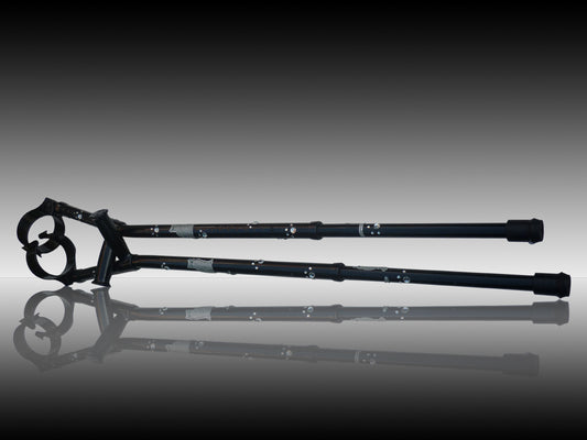 2 catwalk crutch next together. The design is black with a cat image with diamanté places along the crutch