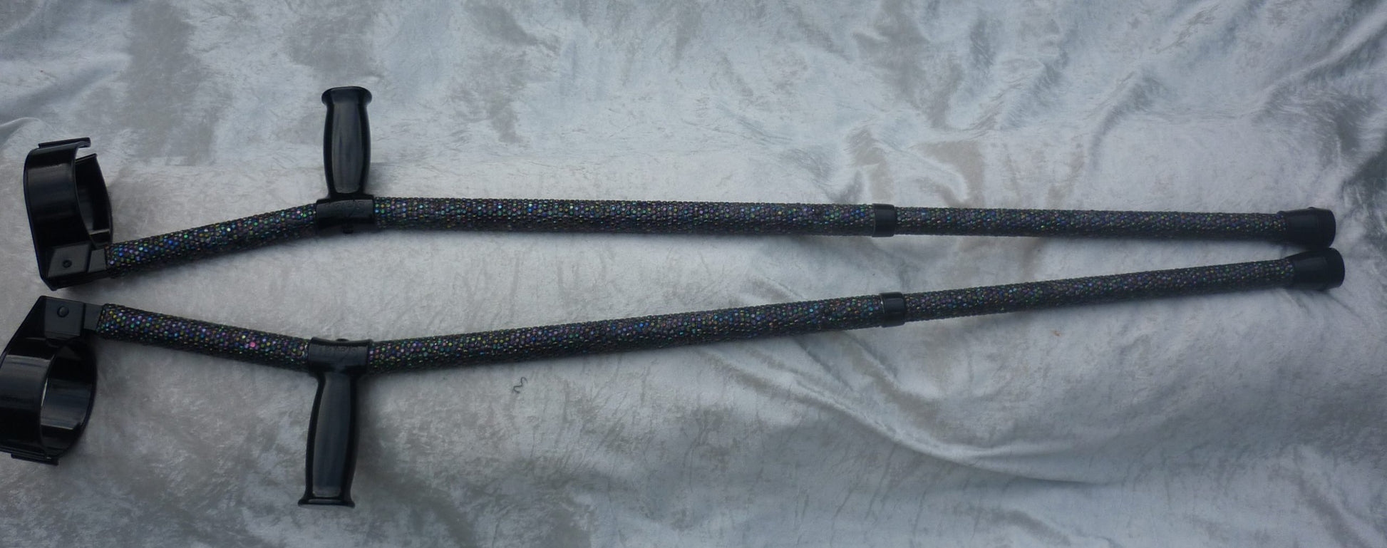 Chameloen Crutch has black iridescent coloured stones that shine like the Aurora Borealis