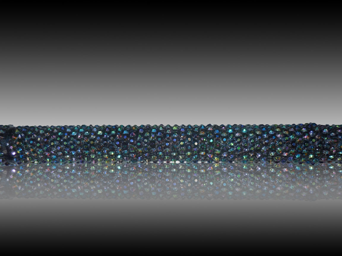 The close up of the iridescent coloured stones that shine like the Aurora Borealis showing random colours.