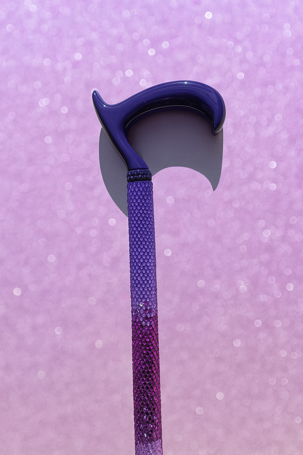 Purple and blue Rhinestone walking stick with a purple glittery background