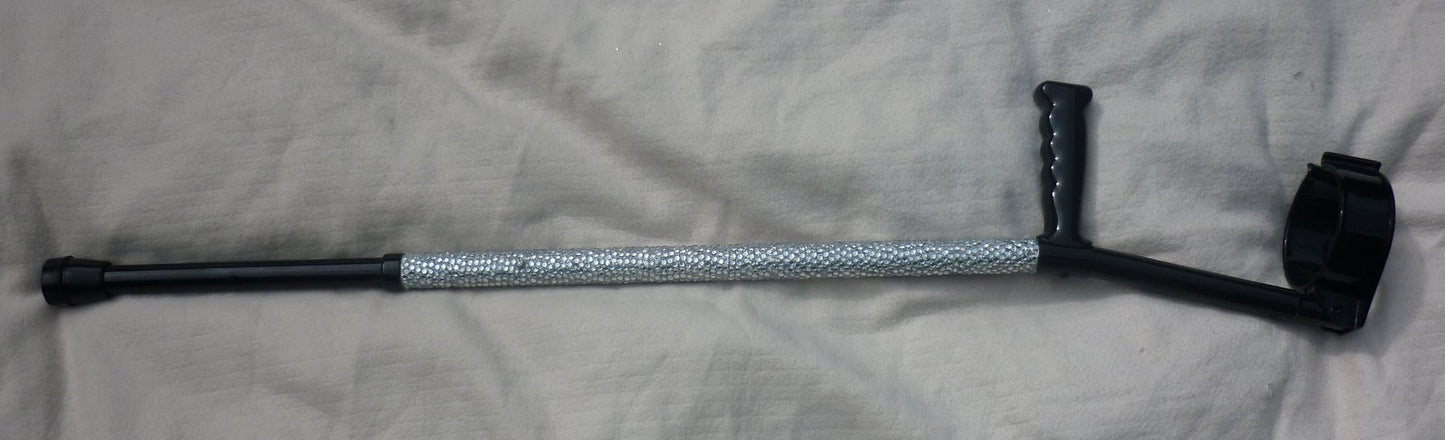 A close up of Diamonds Are A Girl’s Best Friend Crutch showing the clear diamanté. The handle and cuff are in black.