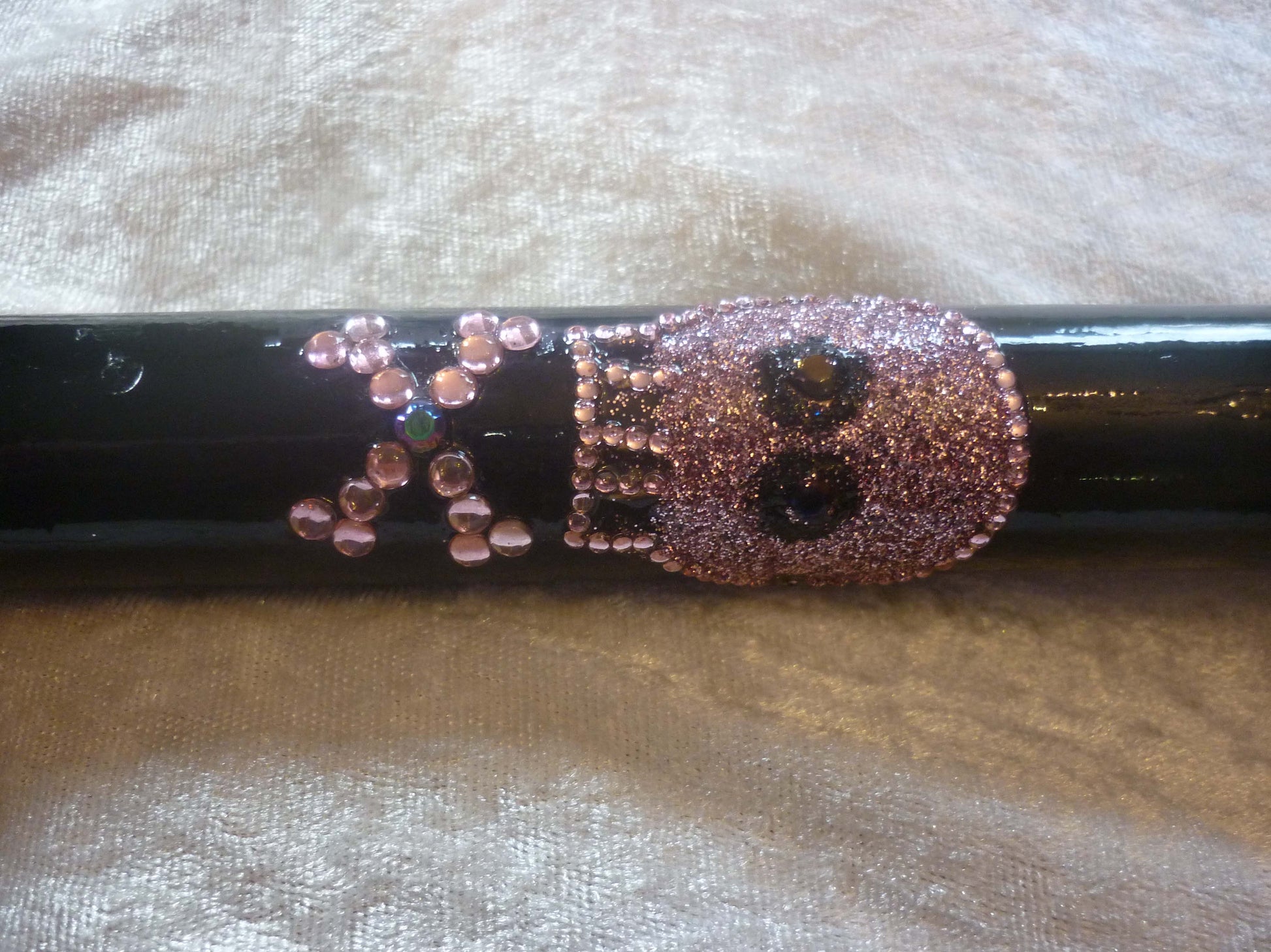 EMOtion Black Walking Stick with emo skull and a cross in pink glitter and diamanté around the outside. The cross has a blue diamanté in the middle.