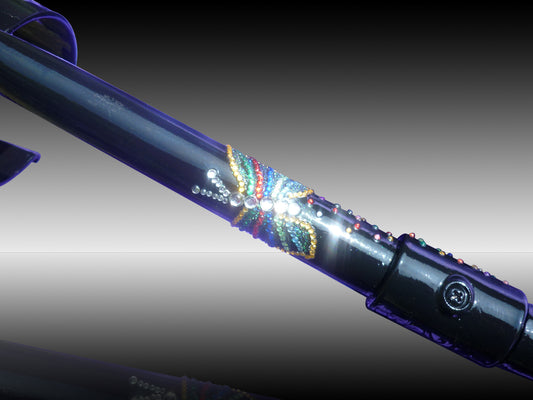 Flutterbye Crutch painted in Purple showing the butterfly decorated in  yellow, green, red, blue stripped diamanté with white diamanté for the body