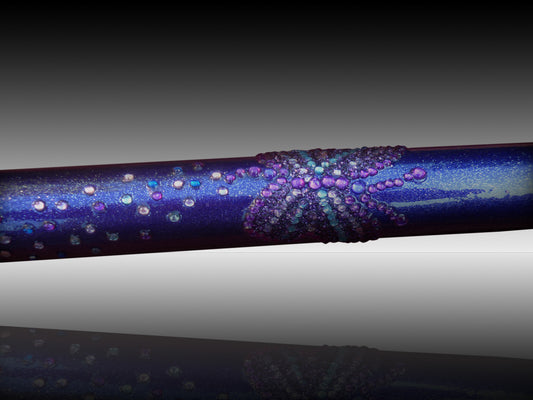 A close up of the GlitterWings which has a shimmery purple colour and is enriched with glitter butterflies picked out in purple and blue diamanté.