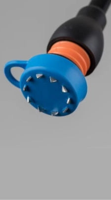 Flexyfoot Ice Boot connected to bottom of a walking stick