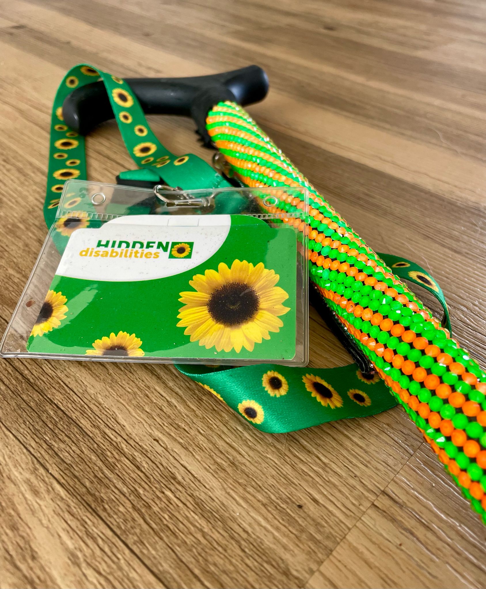 Helenix green and orange stick with sunflower lanyard