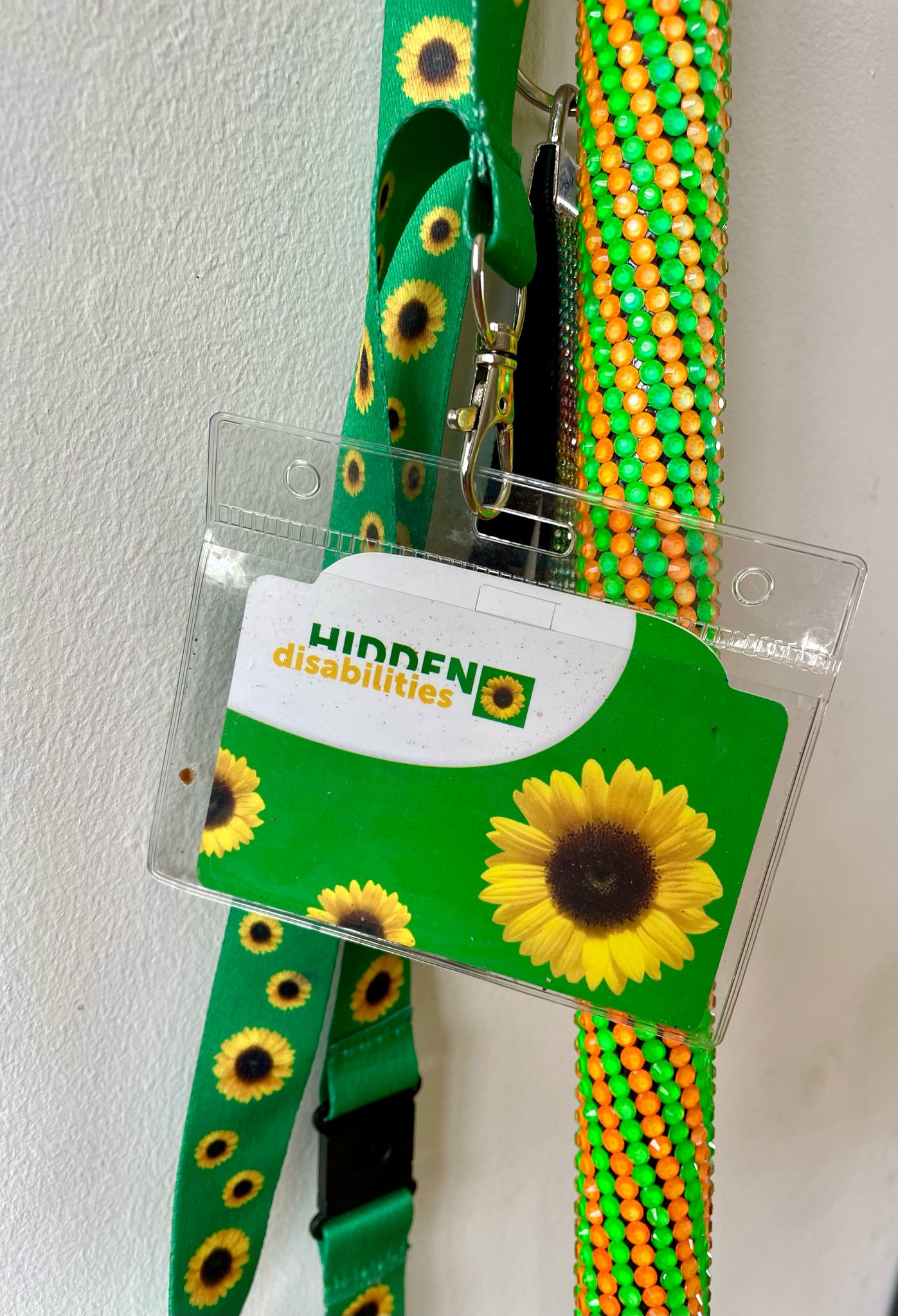 Spiral green and orange walking stick with sunflower lanyard