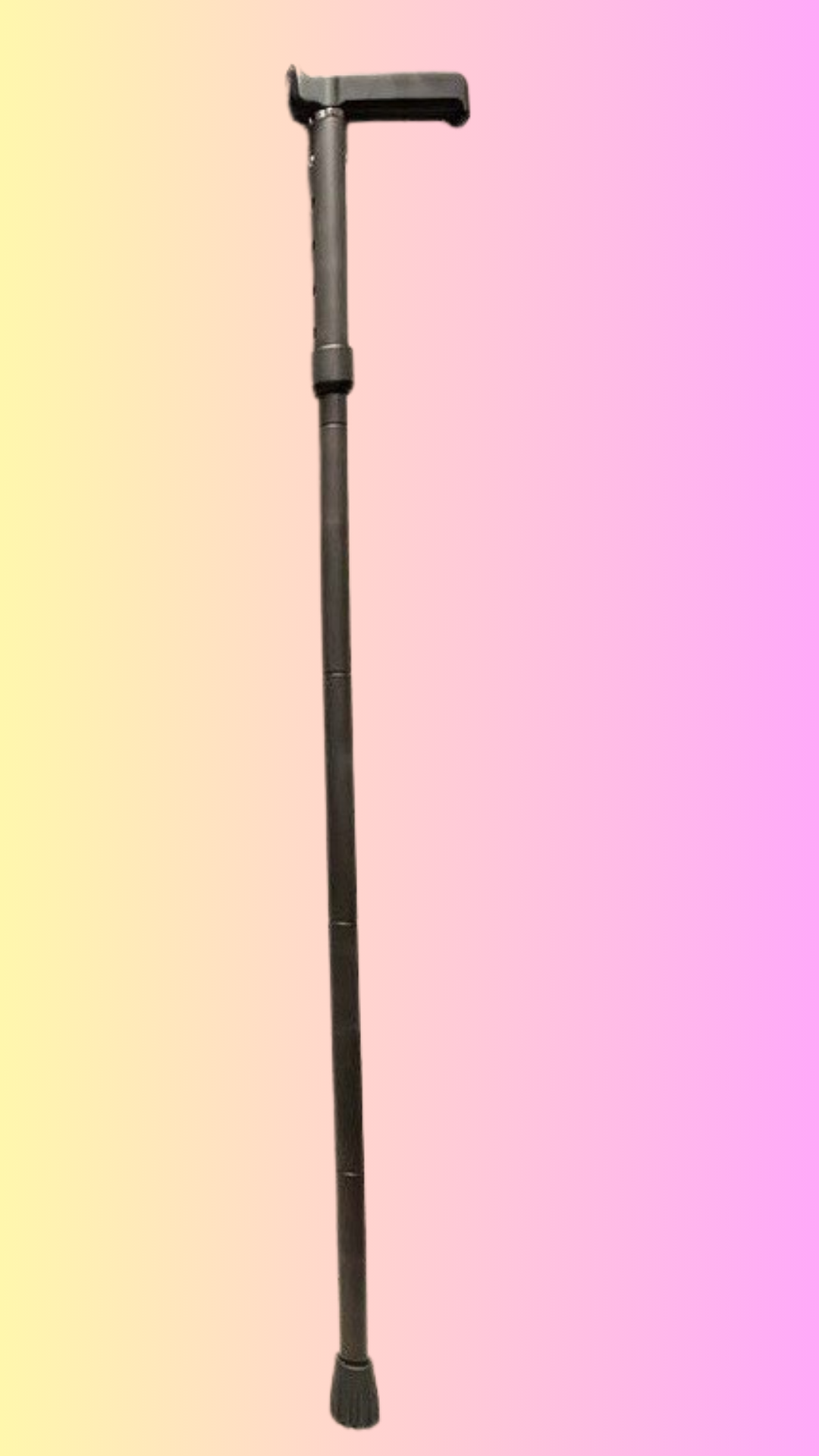 Carbon Fibre Glamstick in Matte Black showing in a background colour of pink and yellow