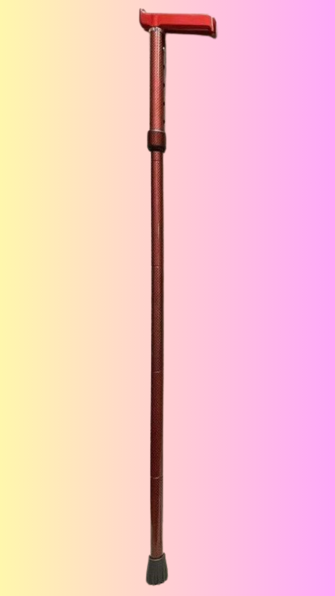 çCarbon Fibre Glamstick in Matte Red showing in a background colour of pink and yellow