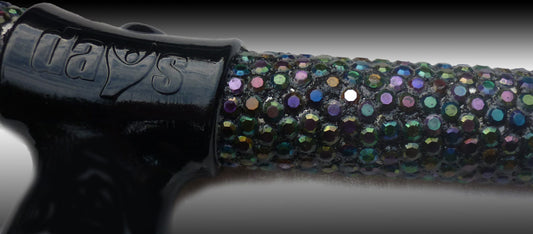 A close up of the diamanté with multiple colours and black handle on the Chameleon Folding Walking Stick 