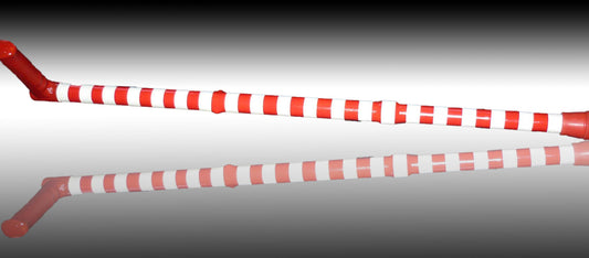 Football Crazy Walking stick in red and white stripes on a reflective surface giving a reflection of the stick