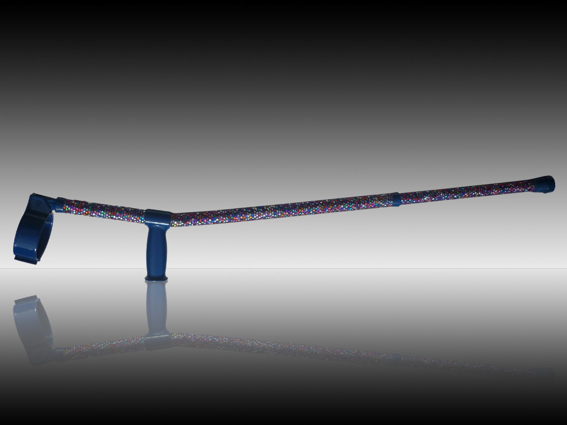 Kaleidoscope Crutch with colour Diamantés on a reflective floor showing a reflection. The Diamantés as showing a random as random colours