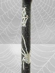 A close up of Titchy Bitsy Spider Crutch shaft showing the spider and web design and diamantés